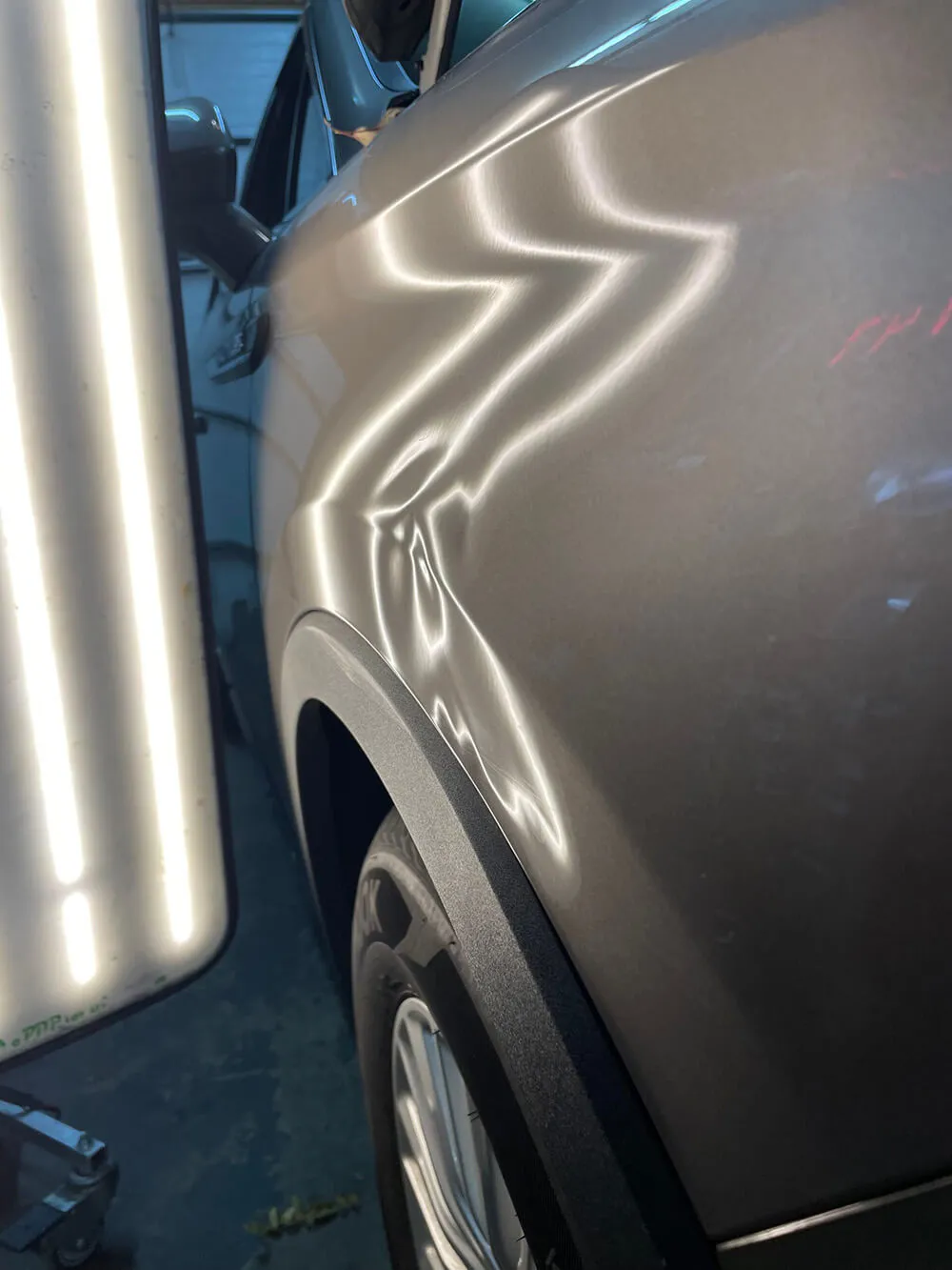 Lincoln-Nautilus-Fender-Before-Paintless-Dent-Repair-scaled